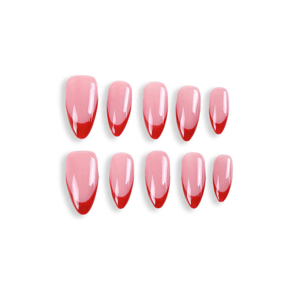 Uñas postizas almendradas 365Nails, color rosa nude con punta francesa roja.