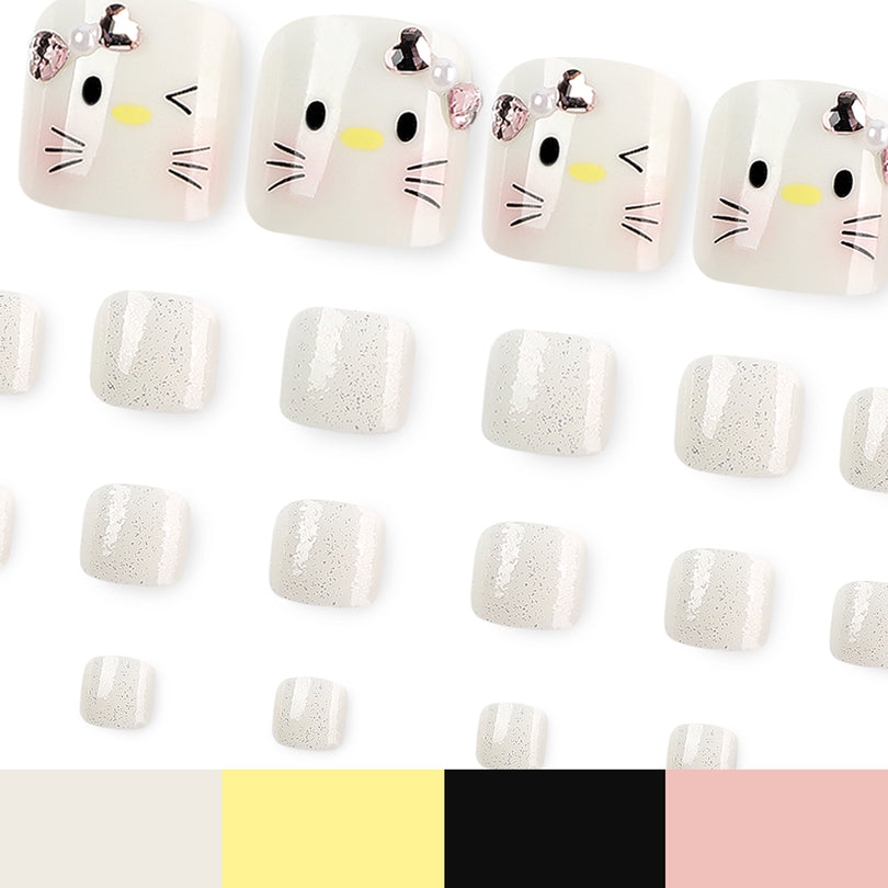 Top view of decorated cat-face toenails and silver glitter press-on nails.