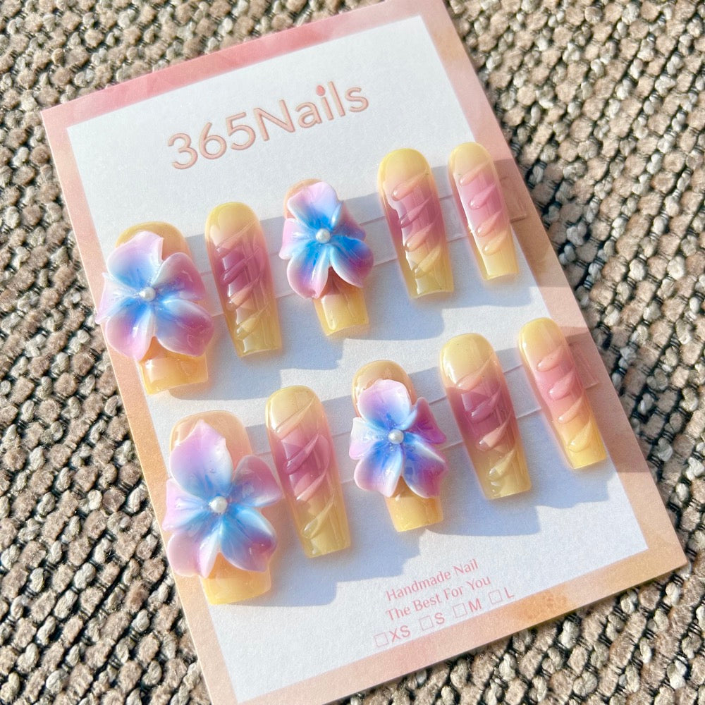 Sculpted Flora: "Dreamy Pastel Flora" – 3D Gradient Purple & Blue Flowers on Yellow-Pink Ombre Coffin Nails with Textured Ribs