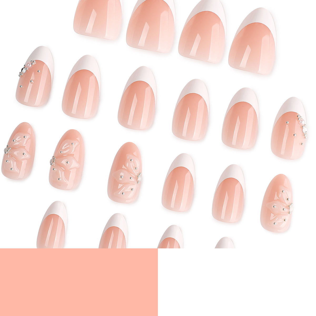 Scattered nude French almond press-on nails with white tips, 3D flowers and rhinestone details.