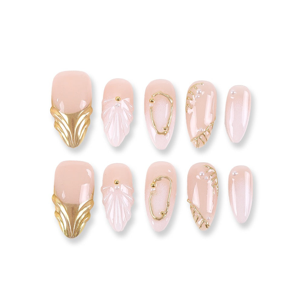365nails nude pink shimmer with shell carving, gold edging and pearls almond press-onsSold in packs of 5. Minimum order: 1 pack (5 pcs). Quantity = number of packs. Qty 1 = 5 pcs