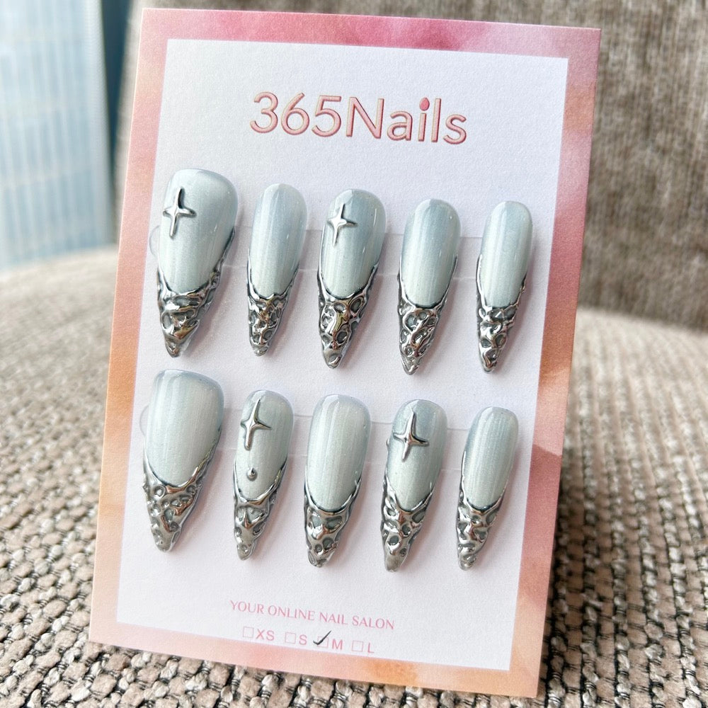 Femme Fatale: "Silver Glacial Melt" – Icy White Cat Eye Base with 3D Liquid Chrome French Tips & Silver Stars Long Stiletto Nails