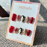 The Gilded Serpent: "Crimson Monarch" – Wine Red & Champagne Gold Textured Press-On Nails with Baroque Cross Charm