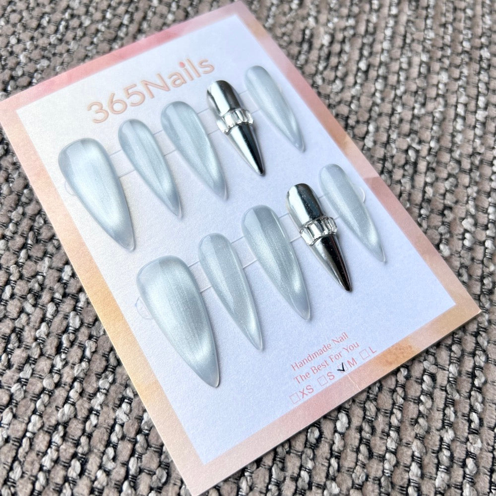 Femme Fatale: "Silver Bullet" – Icy White Moonlight Cat Eye with Full Chrome Silver & Crystal Ring Accent Long Stiletto Nails