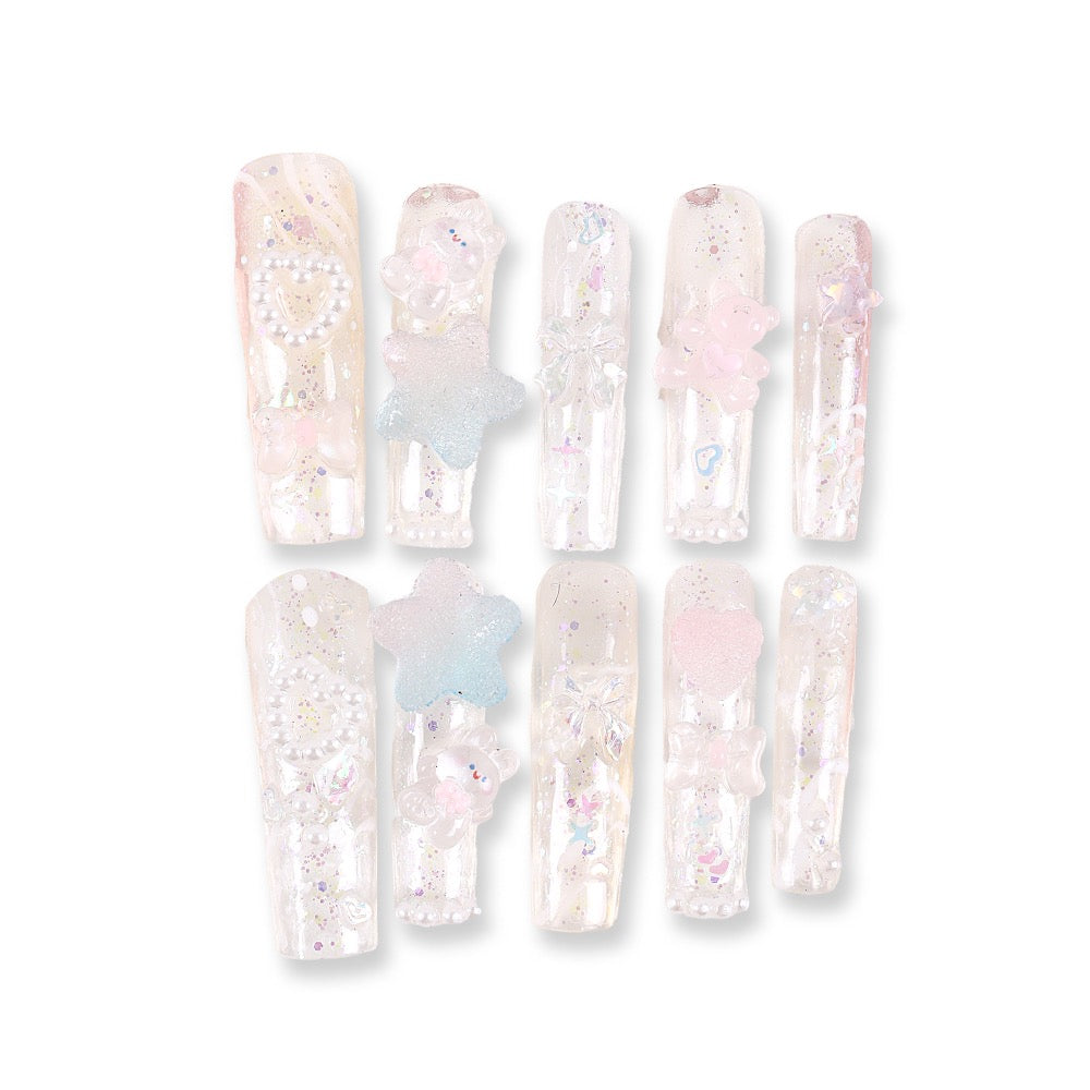 365Nails Iridescent Jelly Long Coffin Press On Nails with 3D Stars, Bows and PearlsSold in packs of 5. Minimum order: 1 pack (5 pcs). Quantity = number of packs. Qty 1 = 5 pcs