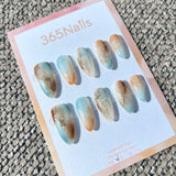 Ethereal Ink: "Coastal Amber" – Icy Blue & Caramel Sand Marble with Gold Flakes & Ink Smudge Almond Nails