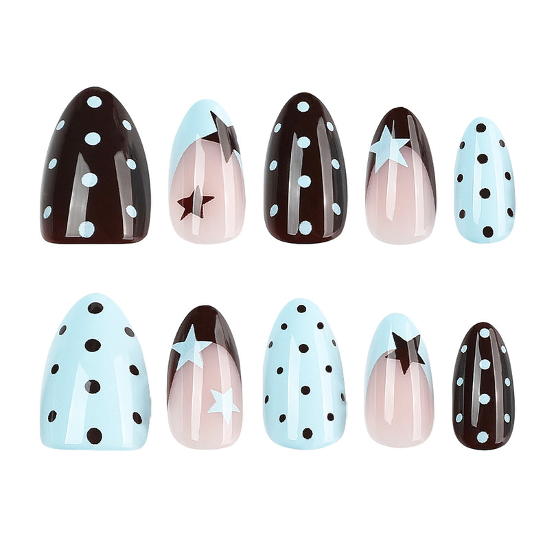 Arranged brown blue and nude press-on nails with star and polka dot patterns