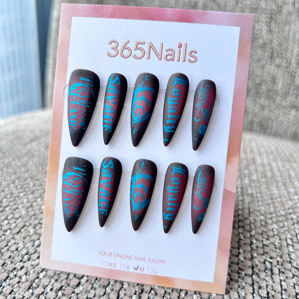 Femme Fatale: "Savage Loyalty" – Matte Black & Red Aura with Electric Blue Gothic Lettering Long Stiletto Nails