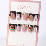 Uñas postizas negras francesas de 365nails con cerezas, estampado de leopardo y mini perlas.