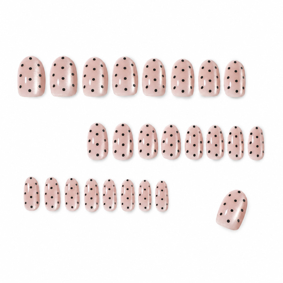 Set of 24 nude pink polka dot press-on nails laid out in rows