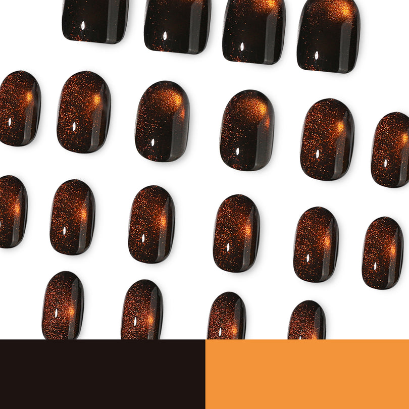 Many brown cat-eye press-on nail tips on white background with a brown and orange color swatch