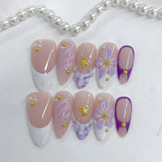 Élégant pastel : « French floraison lavande » — ongles press-on fait main, mi-longs, forme amande, nude & dégradé violet