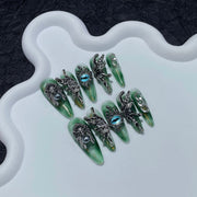Liquid Metal Angel-Eye Nails with Sculpted Wing Accents