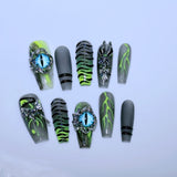 Y2K Press-On Nails with Flame Patterns and Blue Cat-Eye Charms