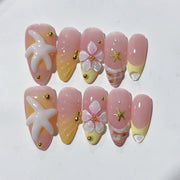 Fleur de plage : « Étoile de mer tropicale » – Ongles press-on forme amande