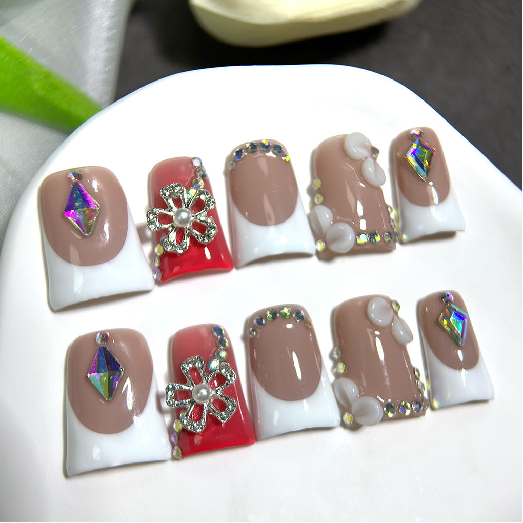 Nude French Nails with Red Accent and Crystal Floral Details
