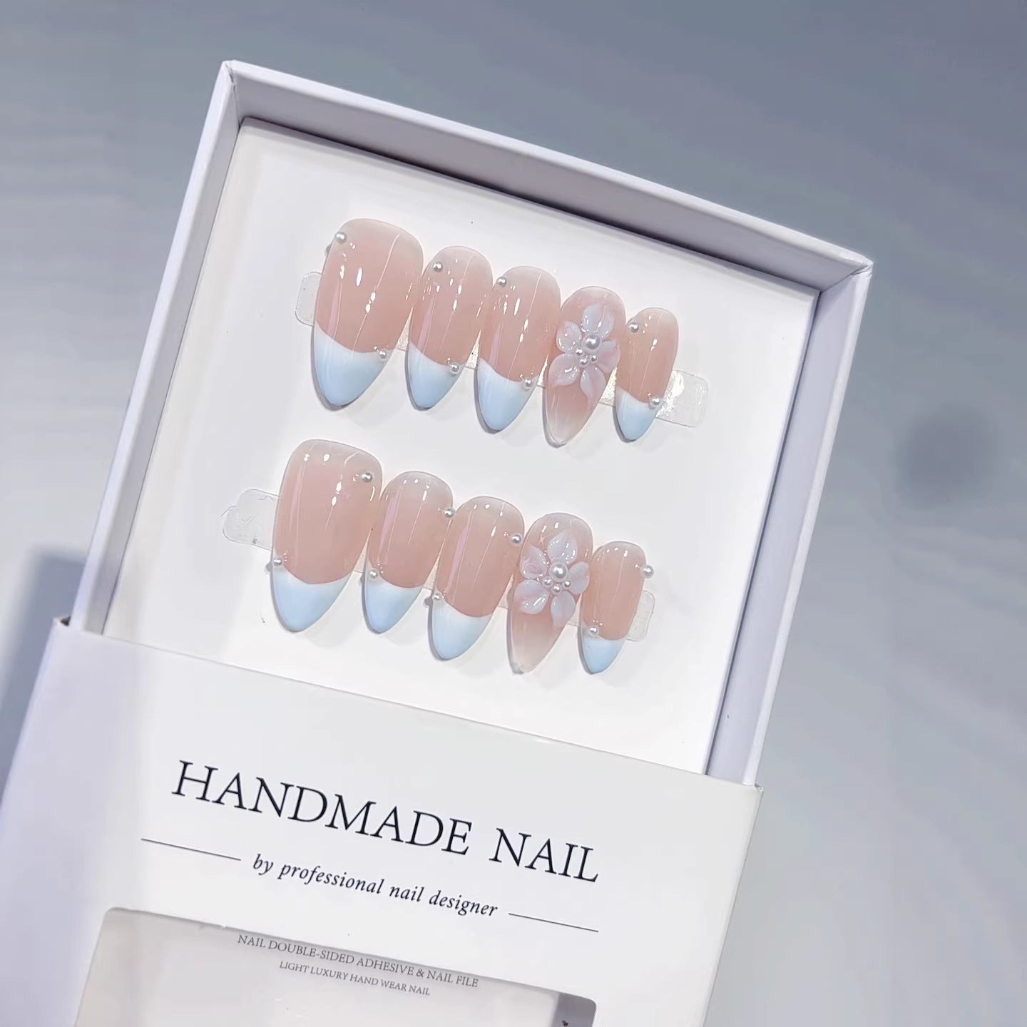 Blue Bloom: "Nude Blue French Flower" – Almond Shape Handmade Press-On Nails