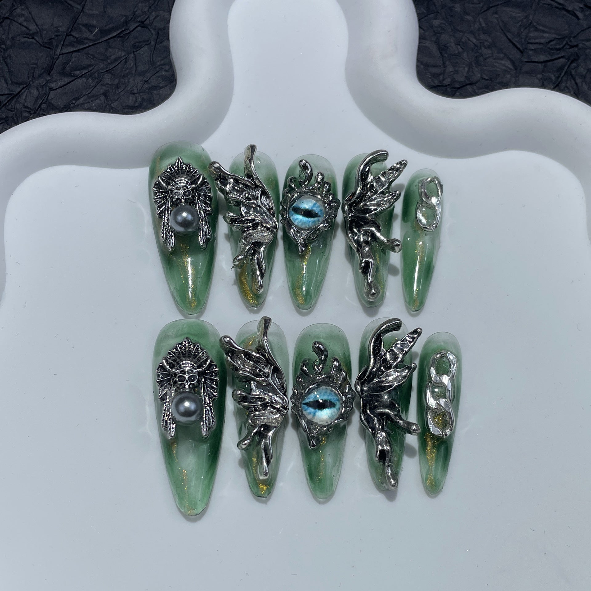 Liquid Metal Angel-Eye Nails with Sculpted Wing Accents