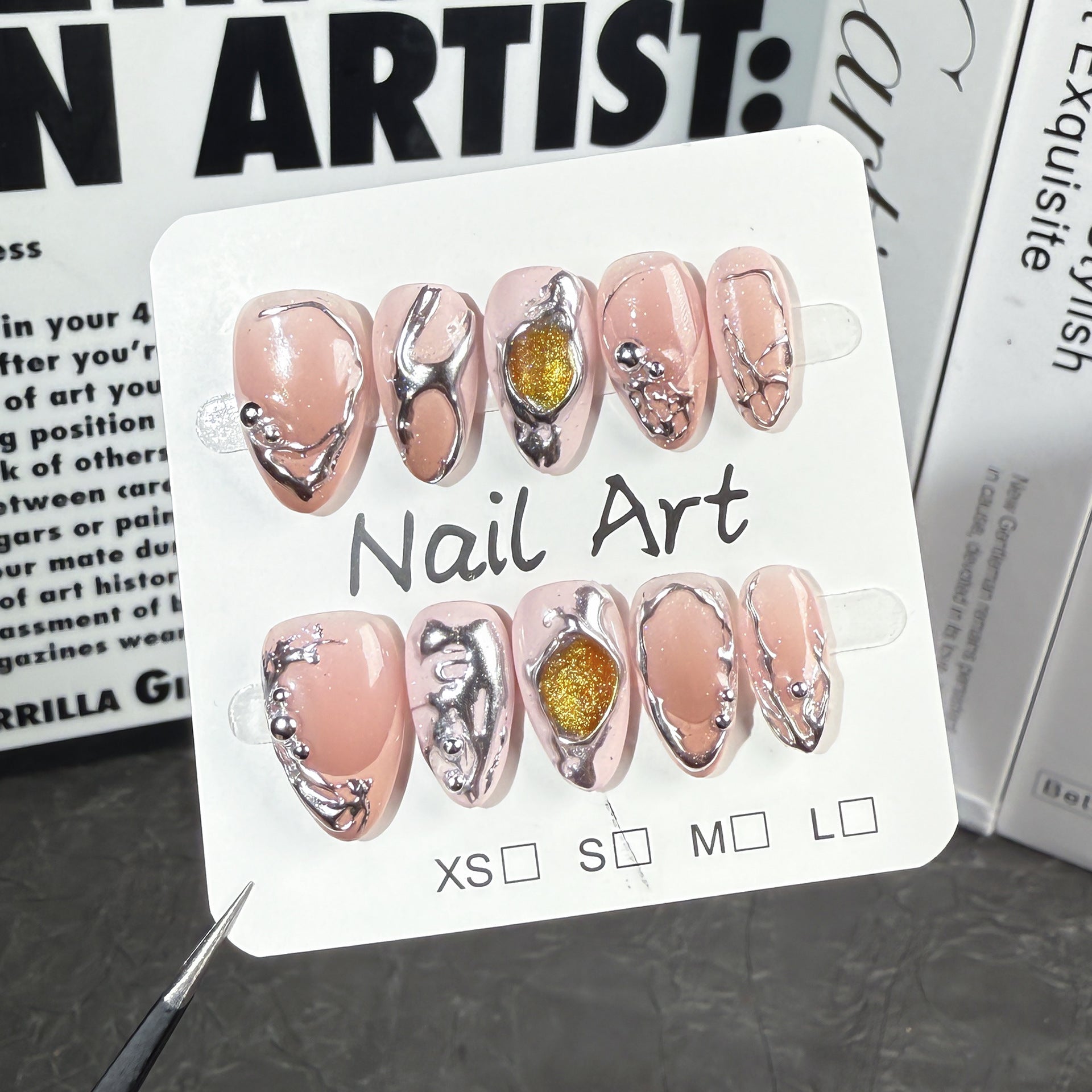 Sculpted Metallic Nails with Irregular Chrome Embellishments