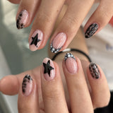 Black White Star Nails with Chic Animal Print Details