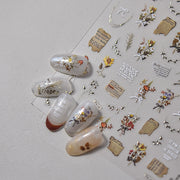365nails: "letra vintage em folha de flor seca" – Adesivos para unhas