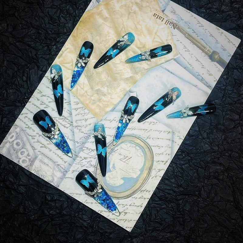 The Art Edit | Blue-Black Butterfly Stiletto Press-On Nails | Crushed Crystal Glitter + Silver Bow Charms
