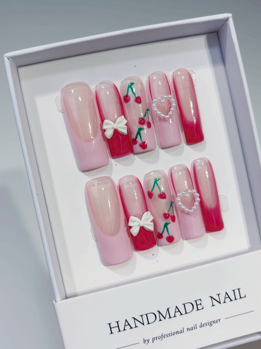 Valentine's day press-on nails: french cherry, bow, and heart designs
