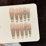 Elegant Nude Gradient Nails with Crystal Charms