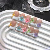 Pastel Floral French Nails with Soft Multicolor Accents