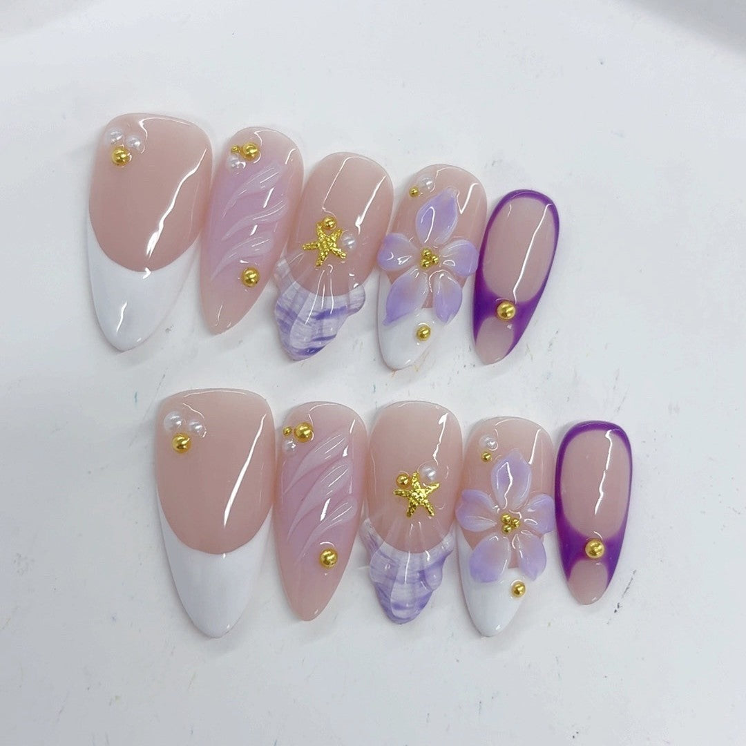 Élégant pastel : « French floraison lavande » — ongles press-on fait main, mi-longs, forme amande, nude & dégradé violet