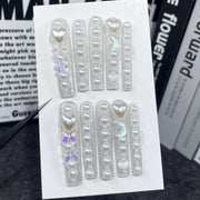 Sparkling Pearl-Encrusted Nails with Heart and Holographic Accents