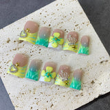 Green Yellow French Nails with Floral and Crown Charms