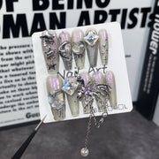 Iridescent Aurora Nails with Shell Textures and Heavy Metal Butterfly Charms
