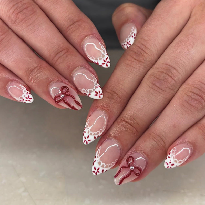 Short Almond Press On Nails with Nude Base & Gold Bow & Dot Accents