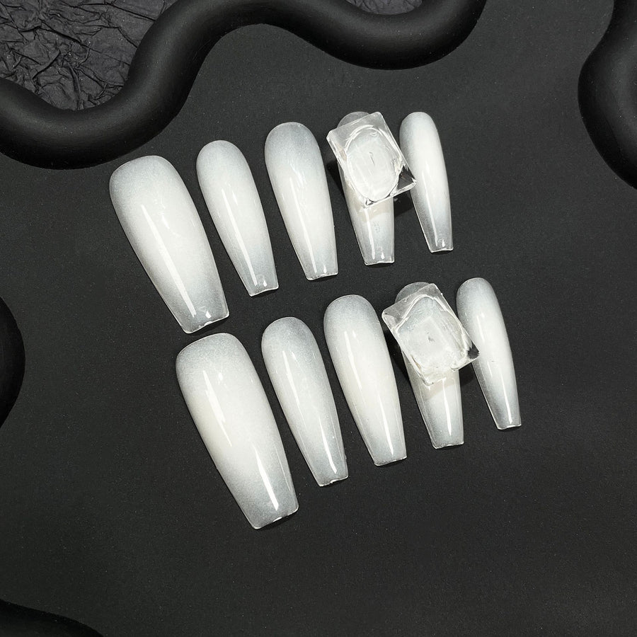 Soft White Gradient Nails with Minimalist Crystal Accents