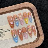 escultura de rouxinol da ilha de amêndoa pintada à mão beliscando unhas removíveis de primavera e verão feitas à mão | 365nails