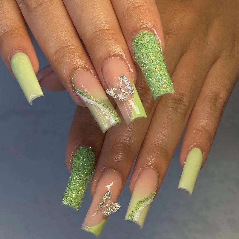 Uñas postizas con diseño de mariposa 3D con purpurina y borde verde francés para mujer