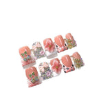 Pink Peach Nails with Floral Charms and Crystal Details