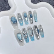 Blue Gem Cat-Eye Nails with Sculpted Metallic Accents