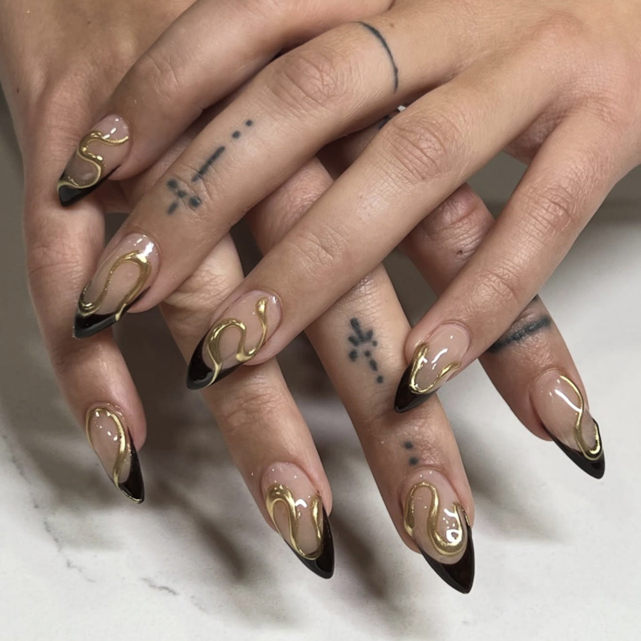 Long Almond Press On Nails with Nude Base & Black French Tip & Gold Line Accents