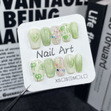 Nueva manicura de primavera y verano Qingti, ojo de gato, bonito lazo pintado a mano, uñas postizas hechas a mano, pegatinas para uñas usables al por mayor｜365nails