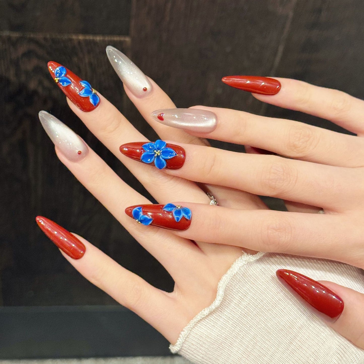 Red Pearl Nails with Blue Floral Accents