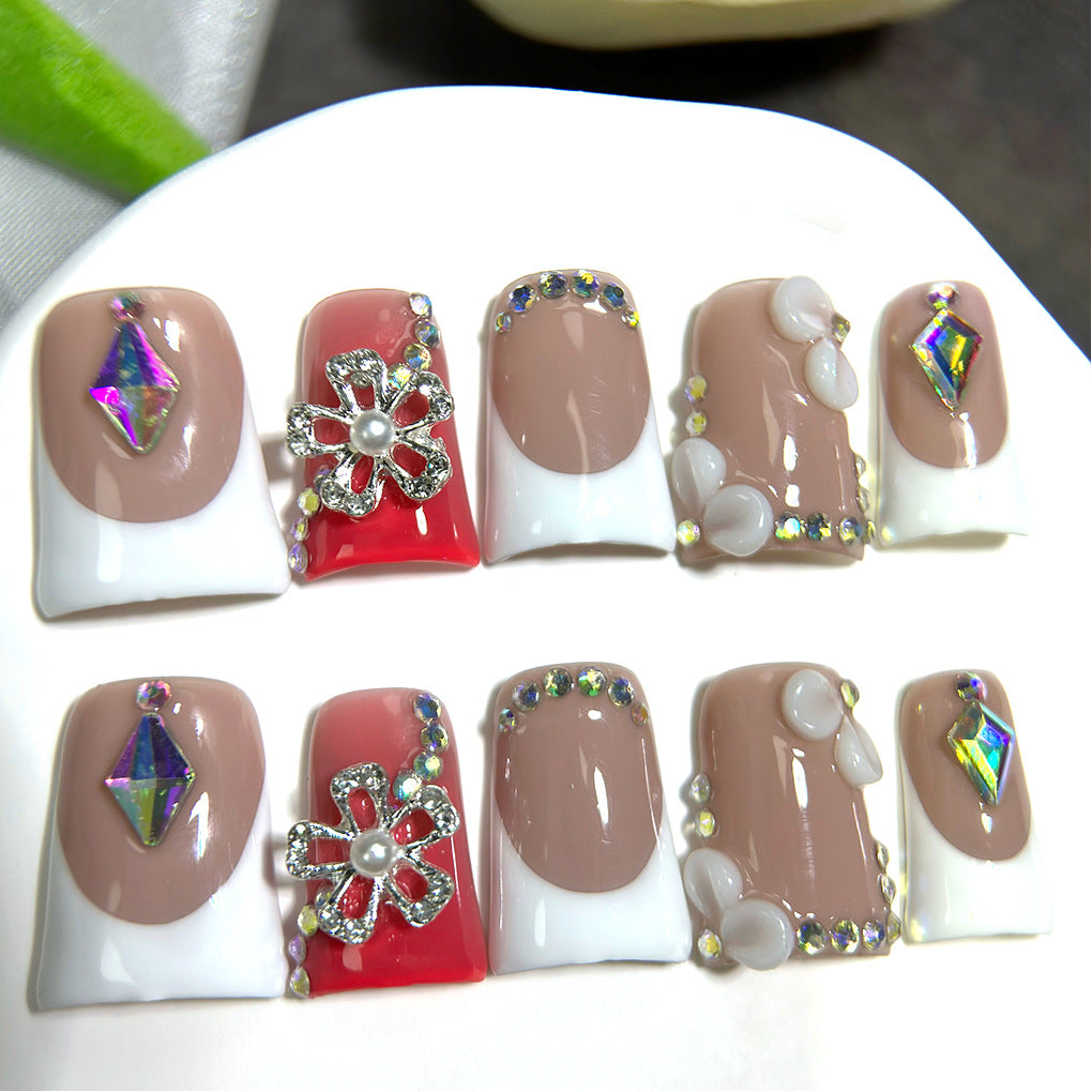 Nude French Nails with Red Accent and Crystal Floral Details
