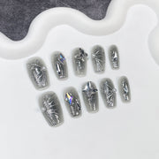 Shimmer Black Blush Nails with Metallic Butterfly Detailing