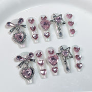Sweet Pink Heart Nails with Sparkling Charms and Girly Shine