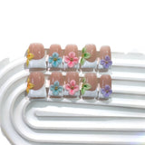 Pastel Floral French Nails with Soft Multicolor Accents