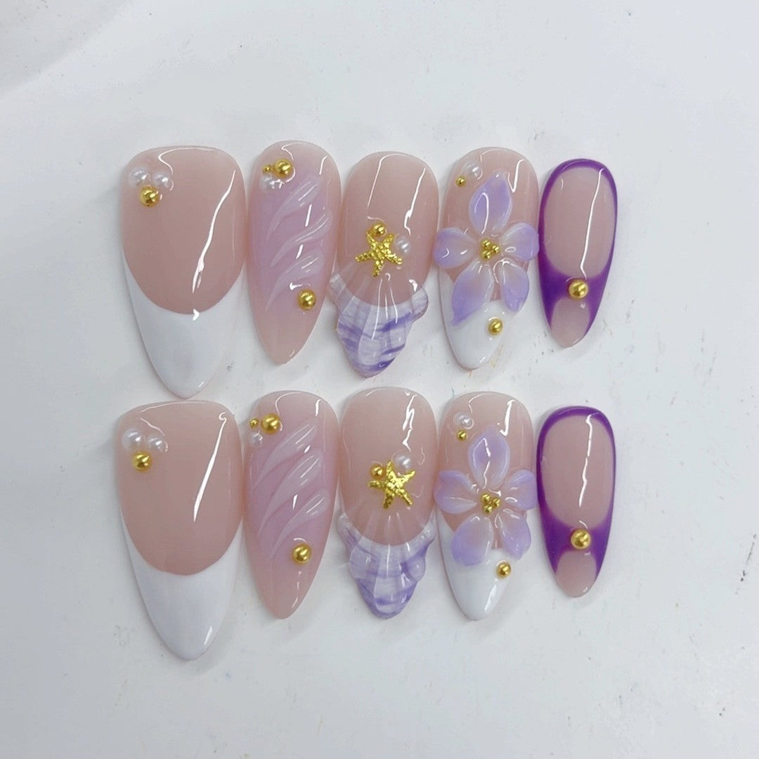 Élégant pastel : « French floraison lavande » — ongles press-on fait main, mi-longs, forme amande, nude & dégradé violet