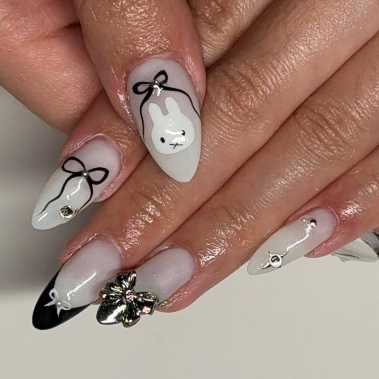 Sweet and Cool Short Almond French Black Metal Bow press-on nails