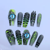 Y2K Press-On Nails with Flame Patterns and Blue Cat-Eye Charms