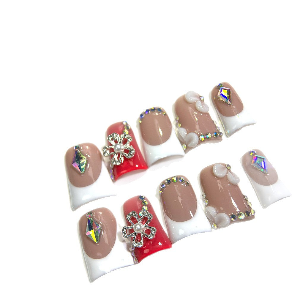 Nude French Nails with Red Accent and Crystal Floral Details